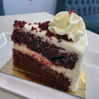 Red Velvet (Slice) · A large slice of our 8in layered red velvet cake with cream cheese filling and icing.
