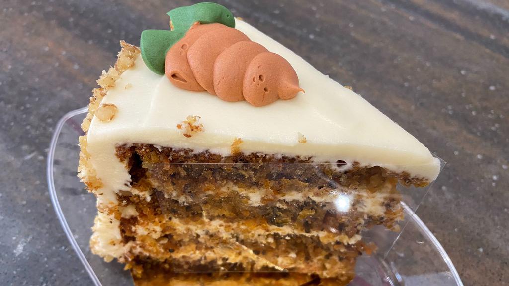 Carrot Cake | New · Classic carrot cake with walnuts and cream cheese buttercream. Finished with an edible carrot decor.