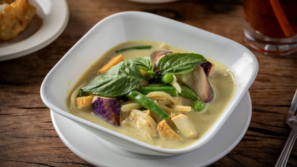 Green Curry · Spicy. Green curry paste, eggplants, green bean, bamboo shoot, coconut milk, and basil.