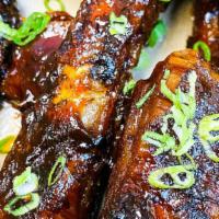 Crispy Fried Ribs  · Single bone spare ribs, smoked, fried, and dipped in an ale BBQ sauce.