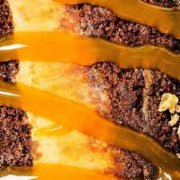 Chocolate Peanut Butter Cake · With bourbon caramel drizzle.