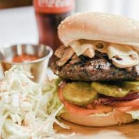 Classic Burger · Beef patty served with American cheese lettuce, tomato, onion, pickles.