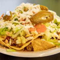 Nachos · Tortilla chips covered w/ refried beans, melted cheese & jalapeno pepper strips