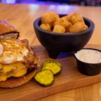 Sunrise Burger · Ground chuck, American cheese, smoked bacon, fried egg and garlic aioli. Served on a grilled...