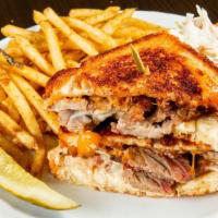 Brisket Grilled Cheese · Balsamic onions, brie, cheddar & sourdough