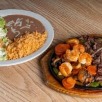 Trio Fajitas · Fajitas with steak, shrimp, and chicken, cooked with carrots, mushrooms, bell peppers, and o...
