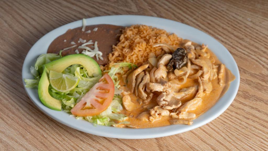 Pollo Chipotle Y Crema · Chicken sautéed with onions and both chipotle and a special creamy sauce.