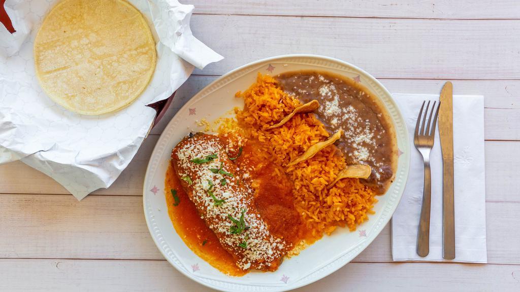 Chiles Rellenos · Two poblano peppers stuffed with cheese, covered in sour cream and a red sauce.

Your choice of flour or corn tortillas.