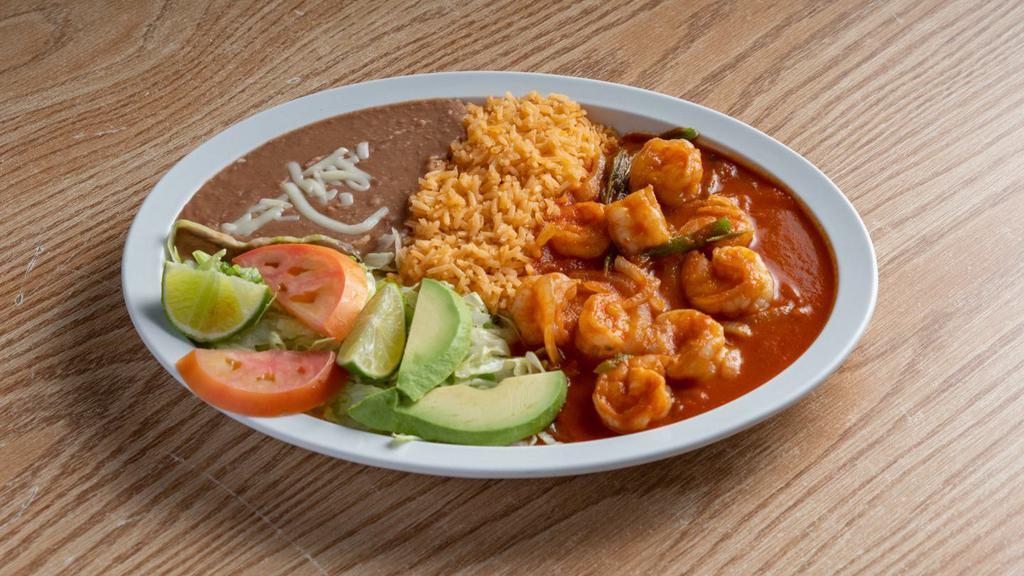 Camarones A La Mexicana · Shrimp cooked with onions, tomatoes, and jalapeno peppers.

Served with rice, beans, lettuce, tomatoes, and a slice of avocado. 
Your choice of corn or flour tortilla.