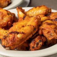 Jumbo Wings (20) · Unbreaded chicken wings fried to a golden brown. Served sauce, and with your choice of dress...