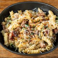 Cajun Mac & Cheese · Cheese sauce, ham, andouille, and roasted poblano peppers, Monterey Jack.