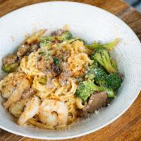 Surf N' Turf Linguini · Beef tips, sautéed shrimp, broccolini, cajun cream sauce.
