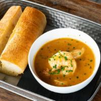 Nola Shrimp · Cajun seasoning, butter, cream, and white wine. Served with baguette for dipping.