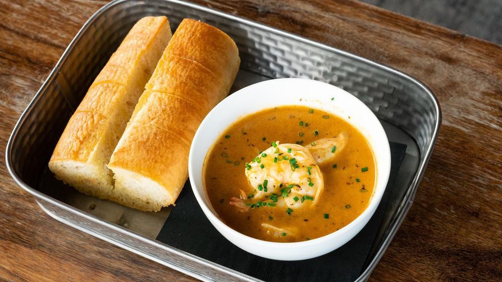 Nola Shrimp · Cajun seasoning, butter, cream, and white wine. Served with baguette for dipping.