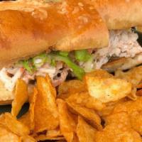 Shrimp Roll Sandwich · Chilled shrimp salad in cajun remoulade with lettuce,  pickles, and onion jam on toasted bag...