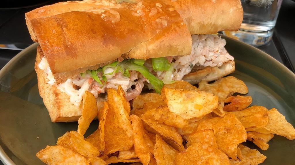 Shrimp Roll Sandwich · Chilled shrimp salad in cajun remoulade with lettuce,  pickles, and onion jam on toasted baguette.