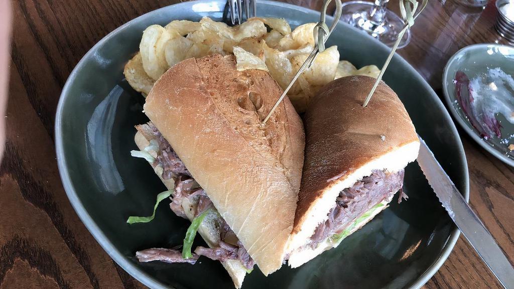 Roast Beef Po' Boy · Hot roast beef with lettuce, tomato, pickle and mayo on toasted baguette.