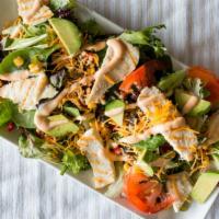 Southwest Chicken Salad · Grilled chicken breast, corn roasted salsa, tomato, cheddar cheese, avocado and chipotle ran...