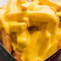 Cheese Fries · Deep-fried golden crunchy fries topped with our cheese sauce.