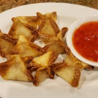 Crab Rangoon · Deep fried wonton filled with cream cheese, imitation crab meat and garlic, served with swee...