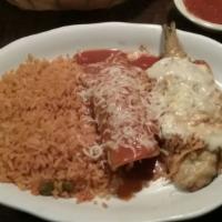 Enchiladas Supremas · Four rolled corn tortillas, one beef, one chicken, one cheese, and one bean, topped with enc...
