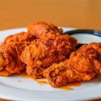 Chicken Wings (Buffalo - Hot) · premium breaded wings, cooked to perfection and smothered in Buffalo - Hot sauce
(approx. 7 ...