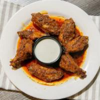 Specialty Wings- Tequila Wings · grilled and sautéed in tequila & lime

(approx. 7 wings per serving)