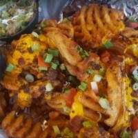 Nacho Fries (Full Order) · waffle fries (or chips) topped with melted cheese, tomatoes, bacon, green onion, ground beef...