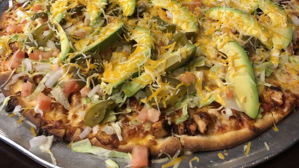 Taco Pizza · pizza sauce, ground beef and jalapeños topped with lettuce,
tomato, onion, avocado, and cheddar cheese on a thin crust