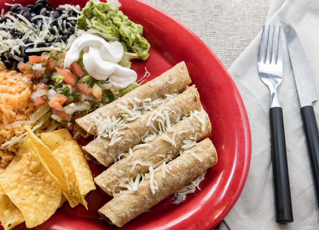 Tres Taquitos (Flautas) Plate · Tres chicken or beef rolled tortillas, deep fried and served with rice and beans (black or pinto) with anejo cheese, lettuce, pico de gallo, sour cream and guacamole.