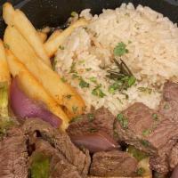Lomo Saltado · beef stir-fry peruvian style, served over french fries & side of rice