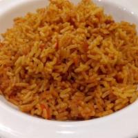 Jollof Rice · Rice cooked in a flavorful tomato purée with natural African spices. Served with choice of t...