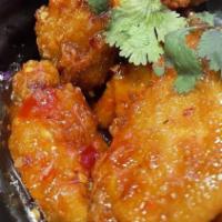 Thai Wings · Deep fried chicken wings tossed in Thai chili sauce.