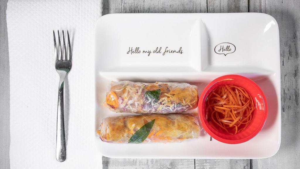 Egg Rolls Wrap · Rice paper rolls with lettuce carrots rice noodle and peanut sauce two rolls.