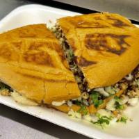 Tortas · Servidas con frijol, lechuga, tomate, queso, jalapeño y aguacate. / Served with beans, lettu...