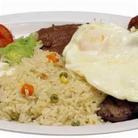 Churrasco · Carne a la plancha, frijol, huevo, chorizo, arroz, ensalada y tortillas. / Grilled beef, bea...