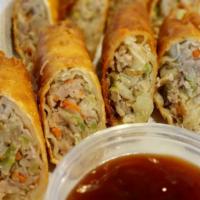 Pork Egg Rolls · Cabbage and shredded pork wonton, fried golden. Served with sweet and sour sauce.