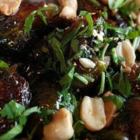 Appetizer Brussel Sprouts · Vegetarian. Roasted and topped with hoisin drizzle, crushed peanuts, and cilantro.