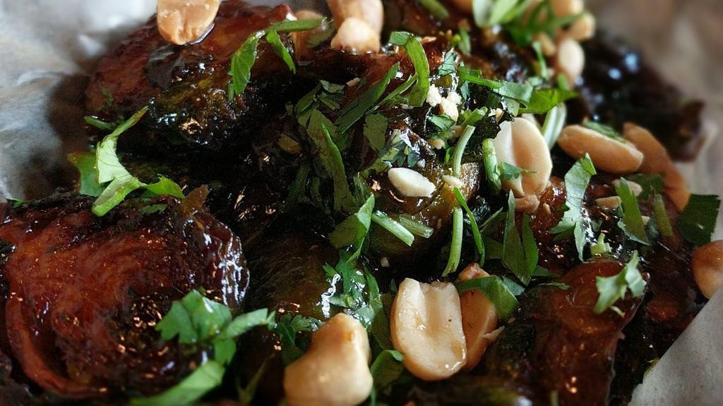 Appetizer Brussel Sprouts · Vegetarian. Roasted and topped with hoisin drizzle, crushed peanuts, and cilantro.