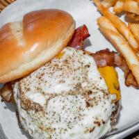 Brunch Burger* · American cheese, Canadian bacon, fried egg, and smoked bacon. *Consumer advisory: Thoroughly...
