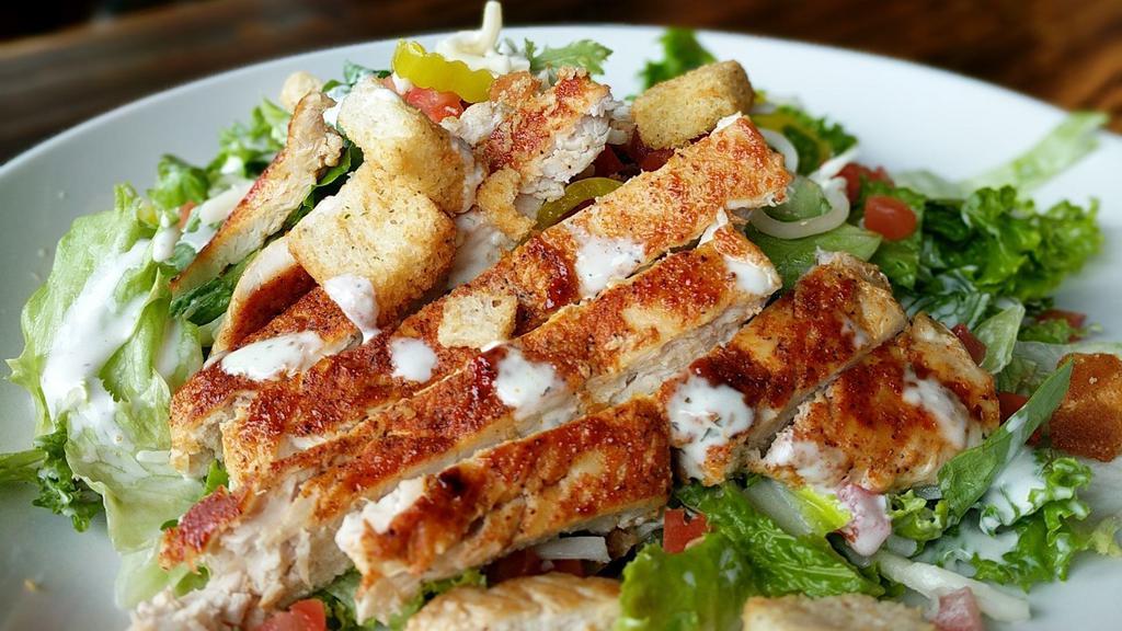 Chicken Ranch Salad · Chopped romaine lettuce, grilled chicken, bacon, tomatoes, banana peppers, mozzarella cheese, croutons, and ranch dressing.