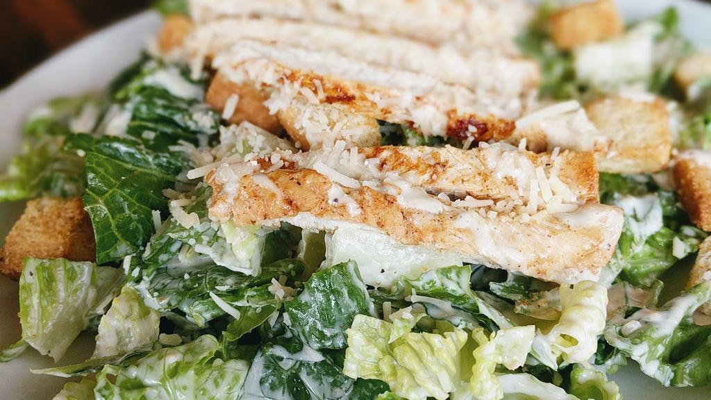 Caesar Salad · Chopped romaine lettuce, grilled chicken, croutons, Parmesan cheese, and Caesar dressing.