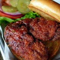Honey Sriracha Chicken · Hand-breaded and fried chicken in honey sriracha. Served with lettuce, tomato, red onion, an...