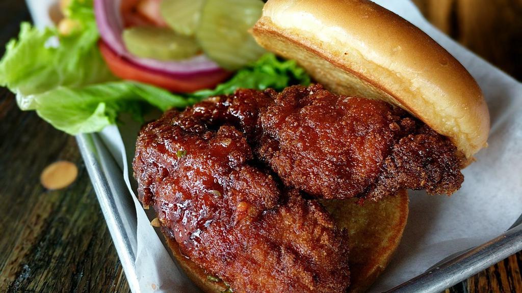 Honey Sriracha Chicken · Hand-breaded and fried chicken in honey sriracha. Served with lettuce, tomato, red onion, and pickle.