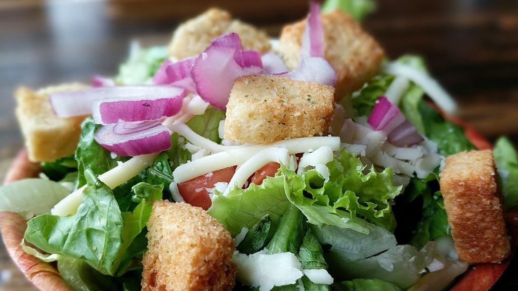 Side House Salad · Chopped Romaine, grape tomato, red onion, carrot, marinated cucumber, shredded Mozzarella, and croutons. Choice of dressing served on side.