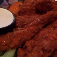 Boneless Wings
 · Tossed With One Of Our Classic Sauces. Served With Ranch or Bleu Cheese & Celery Sticks.