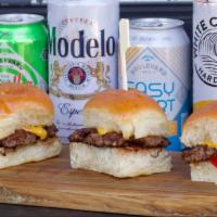 Traditional Beef Sliders · Three mini Black Angus burgers smashed on our flat griddle with onions and signature seasoni...