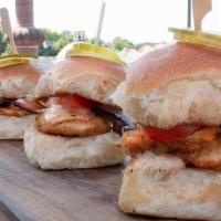 Fried Chicken Sliders · Three pieces of hand-breaded and fried chicken served on freshly baked F2M soft rolls with t...