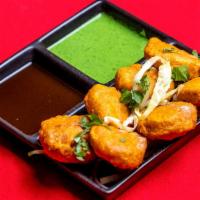 Chicken Pakora · Chopped chicken and onions coated in a chickpea batter and fried.