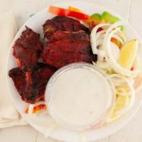 Tandoori Chicken (4 Pieces) · Tender, bone-in chicken pieces marinated in yogurt and spices, then grilled in our clay oven.